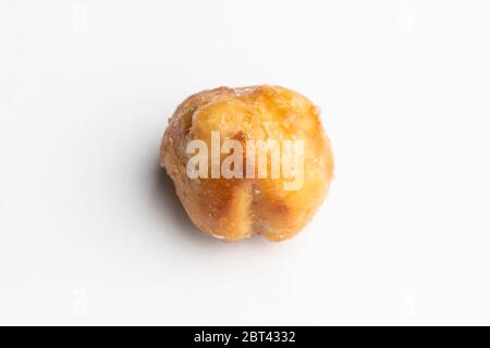One big fresh Roasted hazelnut in caramel isolated on a white background Stock Photo