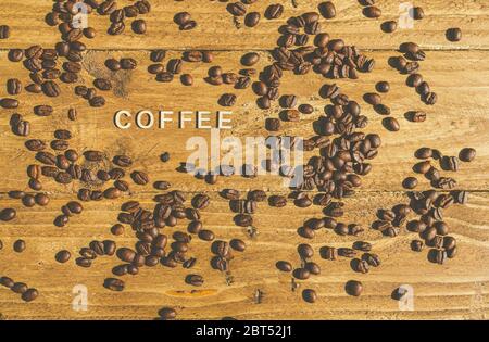 Roasted coffee beans with the word coffee Stock Photo