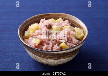 Japanese cooked sekihan rice with red beans in a bowl on table Stock Photo