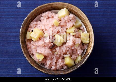 Japanese cooked sekihan rice with red beans in a bowl on table Stock Photo