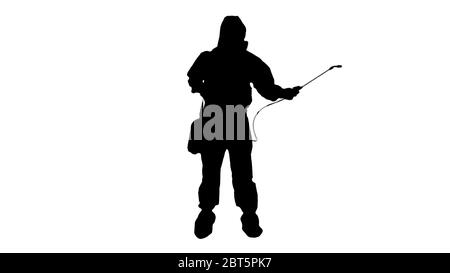Silhouette Man wearing an NBC personal protective equipment (ppe) suit spraying disinfectant water to remove covid-19 coronavirus. Stock Photo