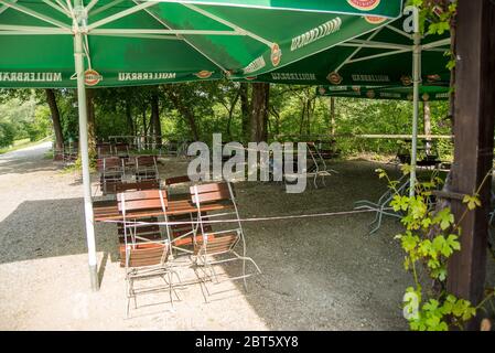 Perach,Germany-May 22,2020: View of a cordoned off Biergarten with tables  set to comply with the new rules for restaurants in Bavaria. Stock Photo