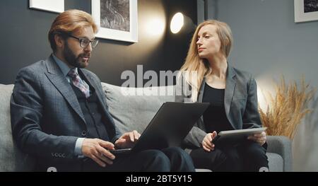 Two business people discussing ideas Stock Photo