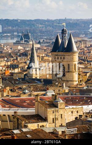 Bordeaux, Gironde Department, Aquitaine, France.  High view over rooftops to Porte de la Grosse Cloche and to the left the spire of St Eloi church. Th Stock Photo