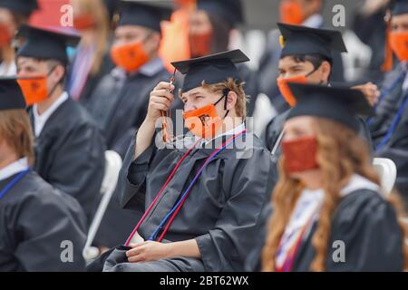 Fort Worth, United States. 21st May, 2020. TEXAS, USA. May 21 2020: Mason Dane moves his tassel from right to left as Seniors are officially conferred during Pilot Point High graduation at the Texas Motor Speedway amid the global coronavirus COVID-19 pandemic. Thursday, May 21, 2020, in Fort Worth, Texas, USA. (Photo by IOS/Espa-Images) Credit: European Sports Photo Agency/17�Թ����� Live News Stock Photo