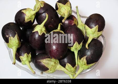 Fresh Raw Sliced Purple Eggplant Brinjal or Eggplant isolated on white background Stock Photo