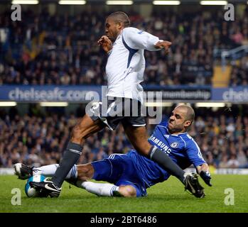 LONDON, UK APRIL 14: Chelsea's Alex makes a crucial tackle against Wigans Wilson Palacios during Premiership League between Chelsea and Wigan Athletic Stock Photo