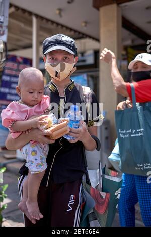 Covid-19 Food.  Free food handout to people in need due to loss of income from Coronavirus funded by local businesses in Pattaya Thailand Asia Stock Photo