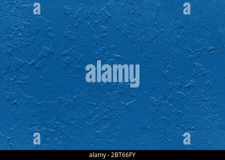 seamless texture of flat thick painted in classic blue color surface under direct sunlight Stock Photo