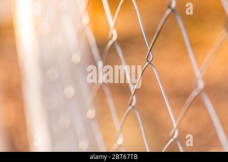 Barbed wire fence with blurred background of the Stock Photo