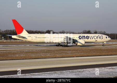 JAL Japan Airlines Boeing 777-300 in special oneworld livery with registration JA732J just landed on runway 07L of of Frankfurt Airport. Stock Photo