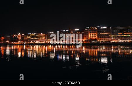 Geneva, Switzerland - November 24, 2016: Night city panorama with illuminated facades of central district of Geneva Stock Photo