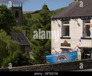 The Railway pub, Marsden with both 'TO LET' and 'NHS / KEY WORKER THANK YOU' signs during the Coronavirus (COVID-19) pandemic. Stock Photo