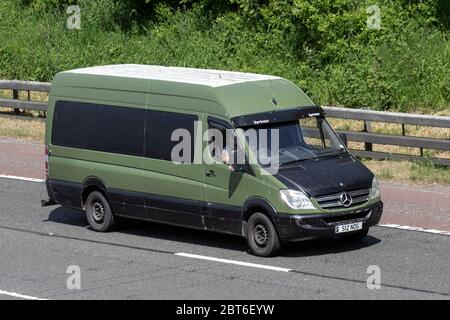 systematic two bid 2007 green black Mercedes Sprinter 311 CDI LWB; Vehicular traffic moving  vehicles, cars driving vehicle on UK roads, motors, motoring on the M61  motorway highway Stock Photo - Alamy