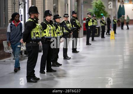 Manchester, UK. 22nd May, 2020. Police officers stand in line at at Manchester Victoria Railway Station as the Manchester Arena BombÕs 3rd Anniversary is marked with a minuteÕs silence, Manchester, UK. Credit: Jon Super/Alamy Live News. Stock Photo