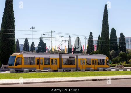 A modern tram ride down the city street. Transport system for passengers in a European city. Stock Photo