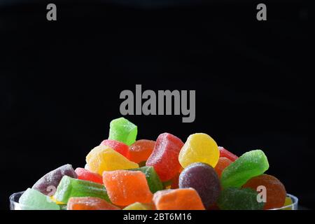 Colorful jelly candies against dark background Stock Photo