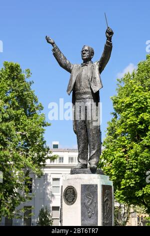 Statue of composer Gustav Holst conducting pose in Imperial Gardens ...