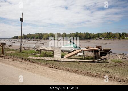 Sanford, USA. 22nd May, 2020. The view of Sanford lake in Sanford, MI, on May 22, 2020. In between the failed dams, this lake is now drained leaving boats and docks high and dry. Failures of the Edenville and Sanford dams on Tuesday afternoon have forced 10,000 people to evacuate their homes. All along the Tittabawassee River, both above and below the dams, houses are destroyed and roads are unsafe to navigate. (Photo by Coleman Camp/Sipa USA) Credit: Sipa USA/Alamy Live News Stock Photo