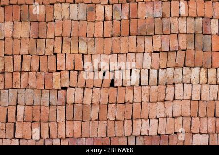 Red bricks arranged in a row. Red bricks pattern background. Red bricks background. Stock Photo