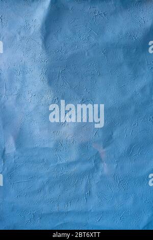 texture crumpled background of blue color close-up, crumpled and with various convexities in structure, textured and rough fragment of fabric Stock Photo