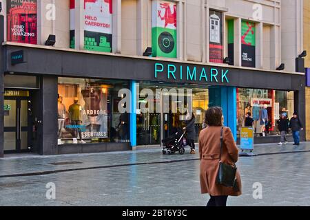 Shoppers passing by the Primark  retail clothing/ fashion store in Queen Street, Cardiff city centre. Stock Photo