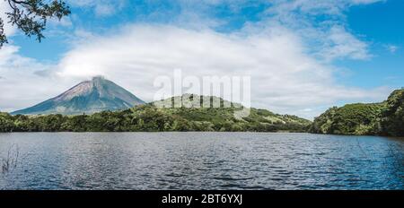 Lush greenery around Chaco Verde lake under the shadow of Volcán Maderas on Ometepe Island in Nicaragua Stock Photo
