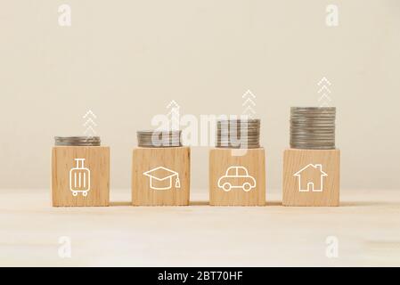 Save money for the future with divided into various sections for tourism, education, cars and housing. Stock Photo