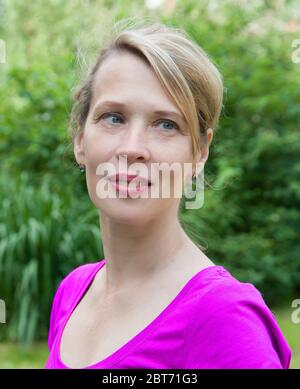one woman 40 years old street portrait Stock Photo