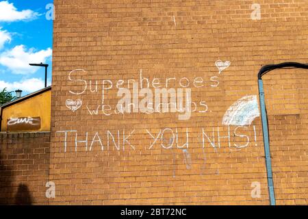 22 May 2020 London, UK - A message on a council estate block in Dalston, Hackney to support the NHS workers during the Coronavirus pandemic outbreak 'Superheroes wear scrubs, Thank you NHS!' Stock Photo