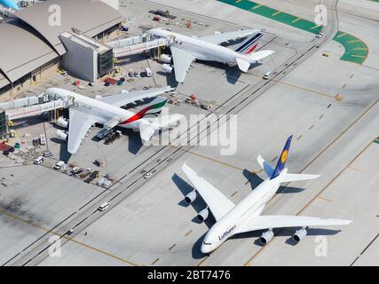 Multiple Airbus A380 parked at TBIT Terminal in LAX. Biggest passenger aircraft together. Air France, Lufthansa and Emirates A380-800 super jumbo. Stock Photo