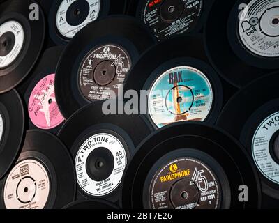 Selection of vintage vinyl 45rpm singles showing different record labels, The popular 7 inch single was first released in 1949 by RCA Victor. Stock Photo