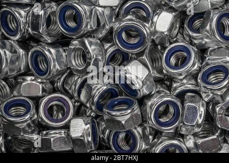 abstract background from hexagonal screw nuts Stock Photo