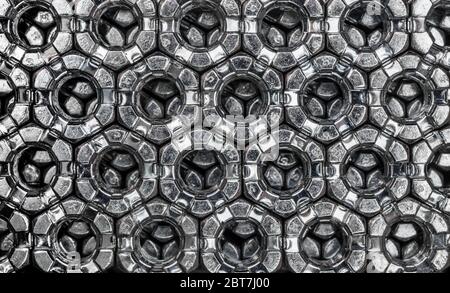 abstract background from hexagonal screw nuts Stock Photo