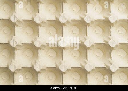 Empty paper packaging for eggs with cells. Abstract background. View from above Stock Photo
