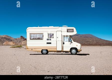 vintage camping bus, rv camper van in desert landscape
