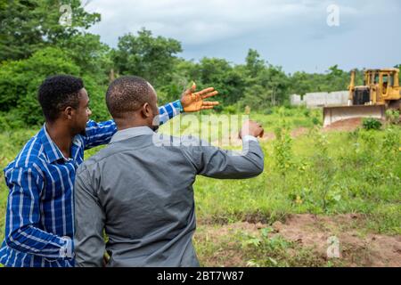 two young african business men, survey a piece of land Stock Photo