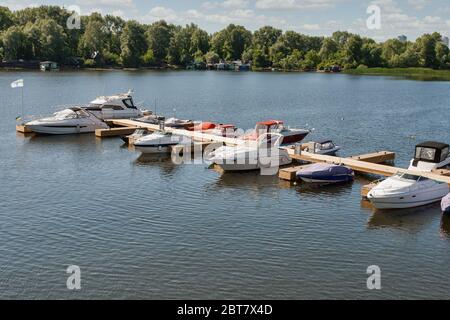 Modern river yachts moored outdoor on Dnieper river in Kyiv, Ukraine. Stock Photo