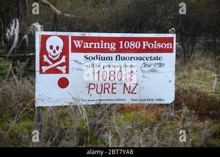 PAPAKURA, NEW ZEALAND; October 5, 2019: Cheeky anti-1080 signage on a West Coast roadside, South Island, New Zealand Stock Photo