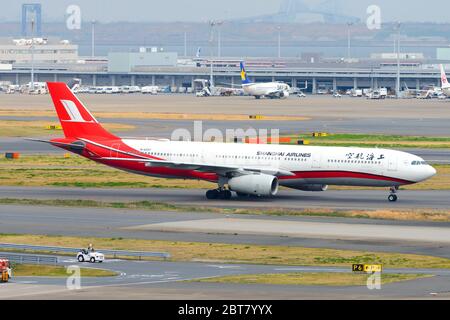 Shanghai Airlines Airbus A330 inbound from Shanghai Pudong Airport. A330-300 B-6097 aircraft taxiing at Haneda International Airport. Chinese airline. Stock Photo