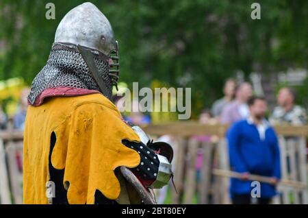 Historical restoration of knightly fights on city festival of medieval culture Stock Photo