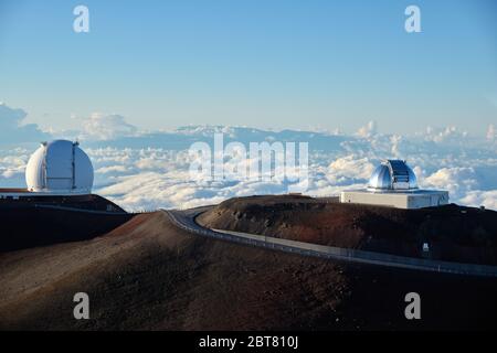 Mauna Kea Observatories (Subaru and Keck I) above the clouds Stock Photo