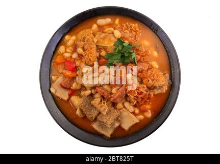 Traditional Portuguese dish using ox honeycomp tripe and cannellini beans in a hearty stew. Stock Photo