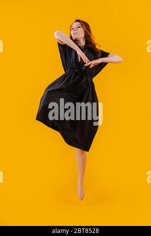 A girl in the dance movement of jump Stock Photo