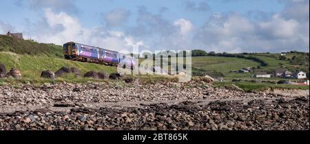 Northern Rail class 153 + 156 passing Mossbay, Workington on the Cumbrian coast railway line