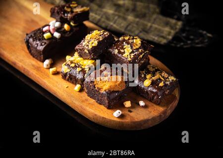Homemade gluten free chocolate brownies as a sweet dessert in black background Stock Photo