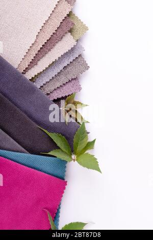 Bright collection of gunny textile samples with empty space for text. Multicolor Fabric texture background. Stock Photo