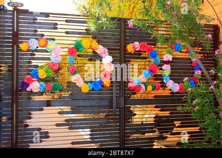 City High School gates with flowers celebrating 2020 graduations Stock Photo