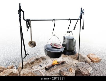 coffee pot boiling over an open fire cowboy flame smoke caffine wild west  Stock Photo - Alamy