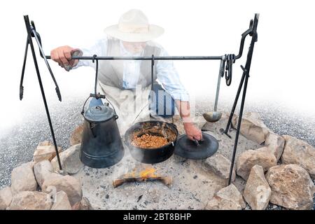 coffee pot boiling over an open fire cowboy flame smoke caffine wild west  Stock Photo - Alamy